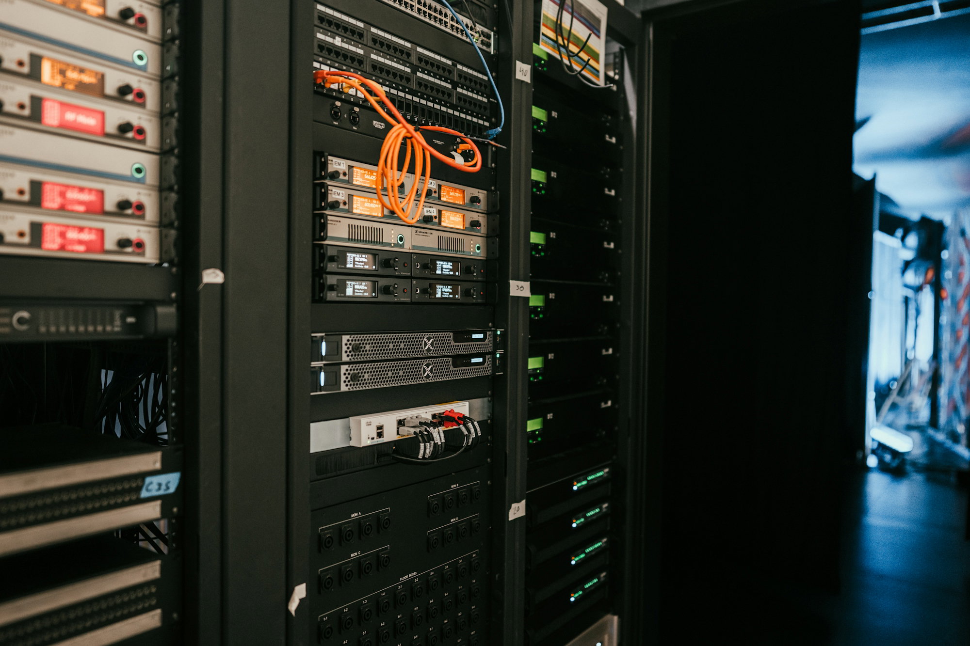 a rack of servers in a server room